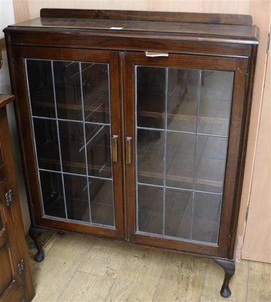 An oak two door leaded glazed bookcase W.92cm
